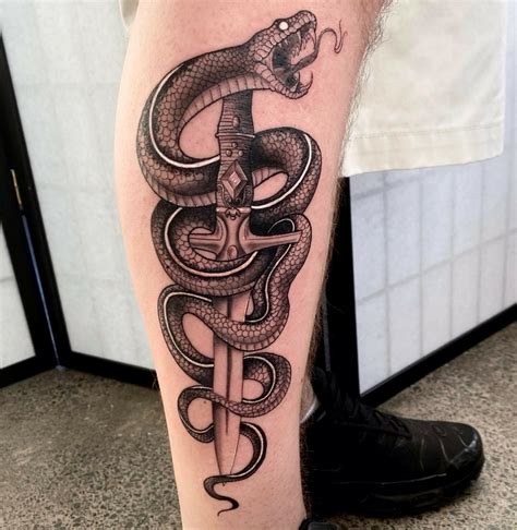 snake leg tattoos